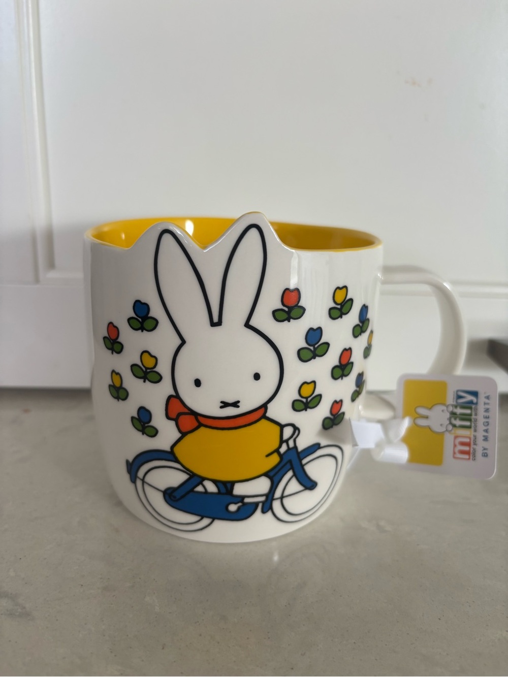 Miffy Yellow Interior Ceramic Mug with Blue Bicycle and Multicolor Tulip Design